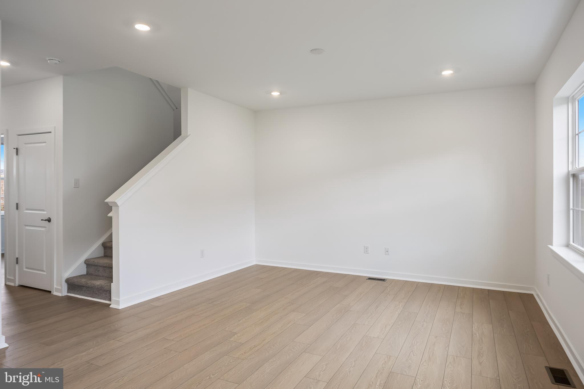 13 Inkwell Lane Sicklerville, NJ 08081 - Photo 9 of 37 an empty room with wooden floor and windows