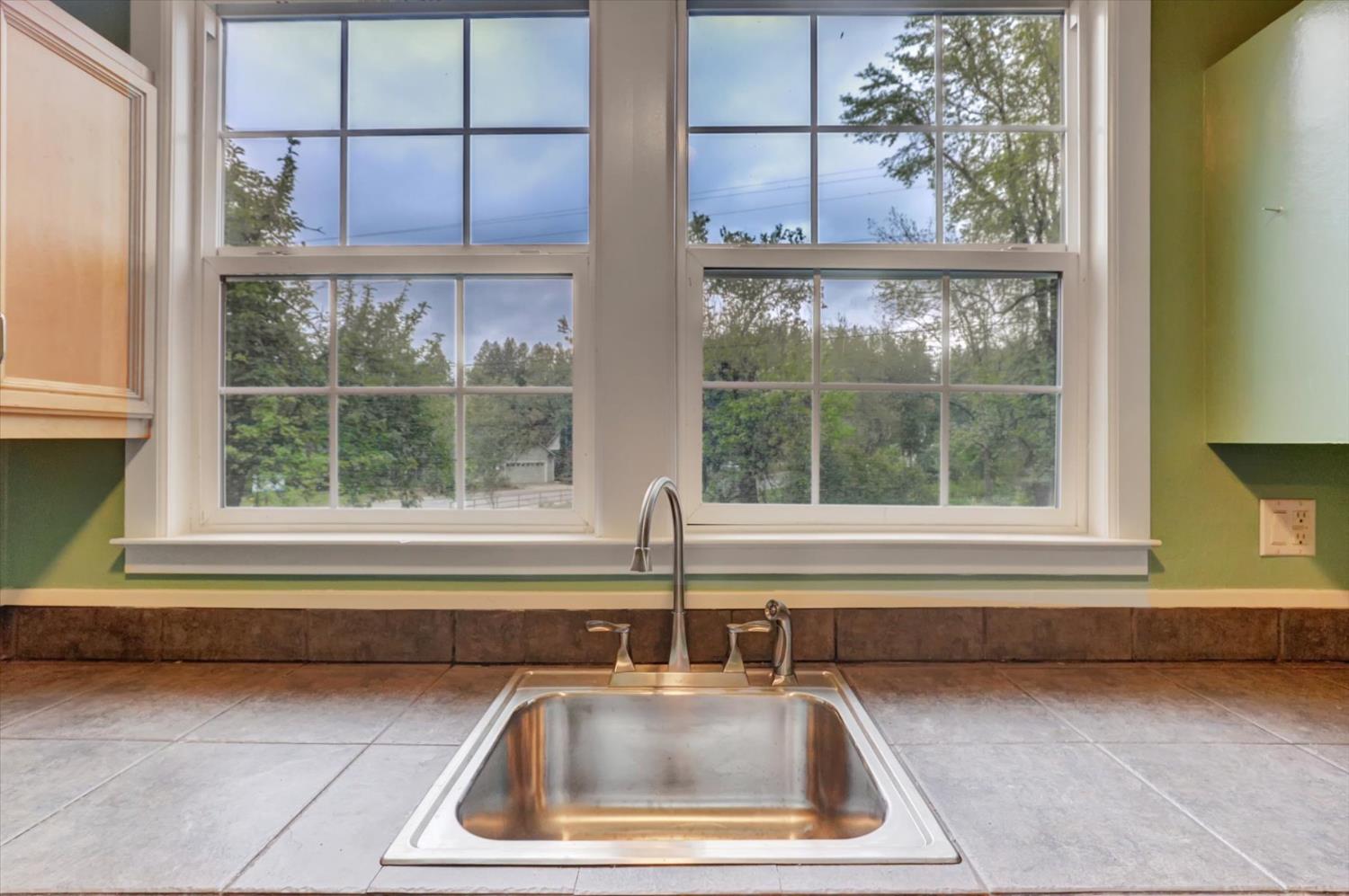 618 Walsh Street Grass Valley, CA 95945 - Photo 12 of 32 a kitchen sink sitting next to a window