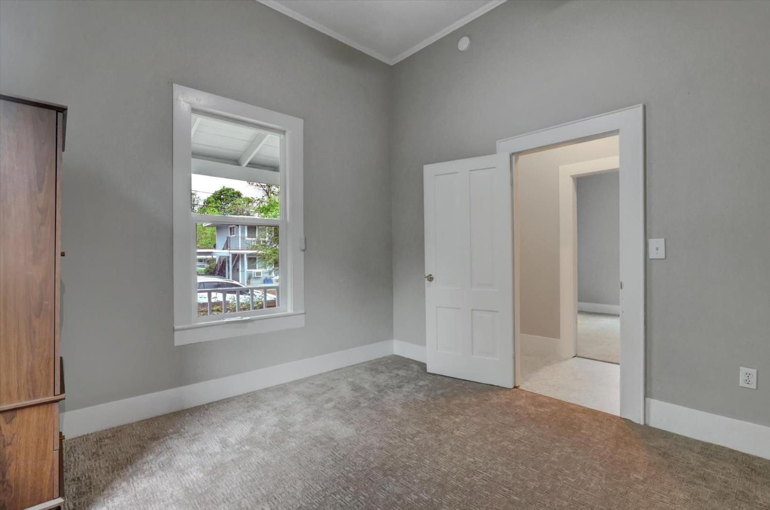 618 Walsh Street Grass Valley, CA 95945 - Photo 19 of 32 an empty room with windows and closet