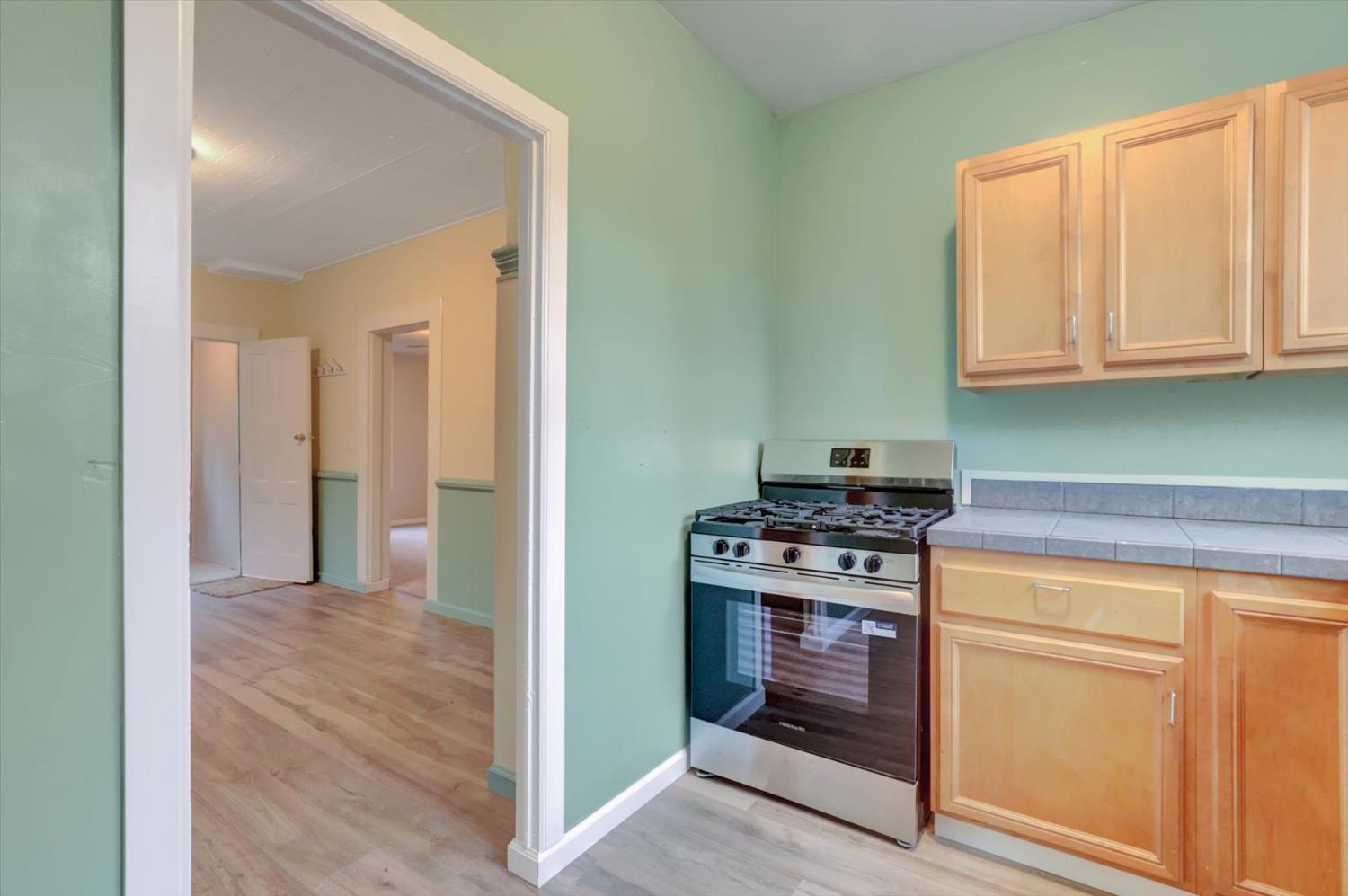 618 Walsh Street Grass Valley, CA 95945 - Photo 8 of 32 a kitchen with a stove and a sink