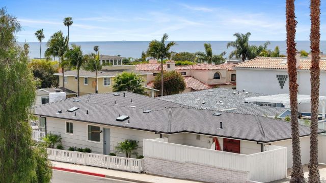 a aerial view of a house with a swimming pool