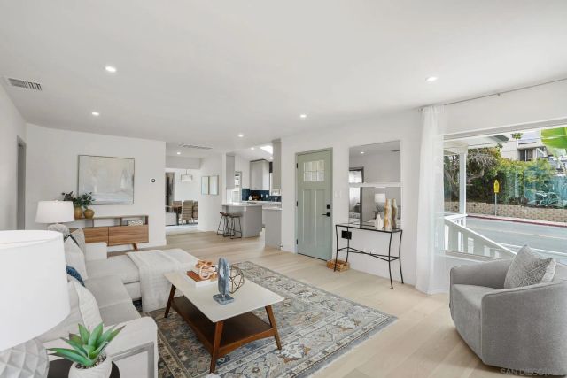 a living room with furniture and a table