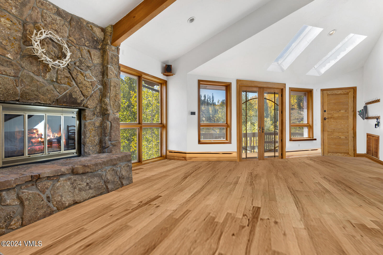 2701 Davos Trail Vail, CO 81657 - Photo 11 of 29 a view of hallway with wooden floor and front door