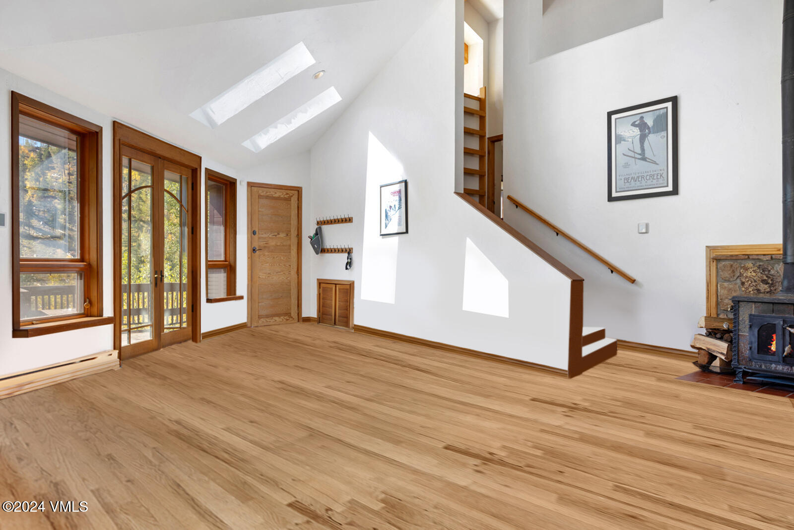 2701 Davos Trail Vail, CO 81657 - Photo 13 of 29 a view of an empty room with wooden floor and a window