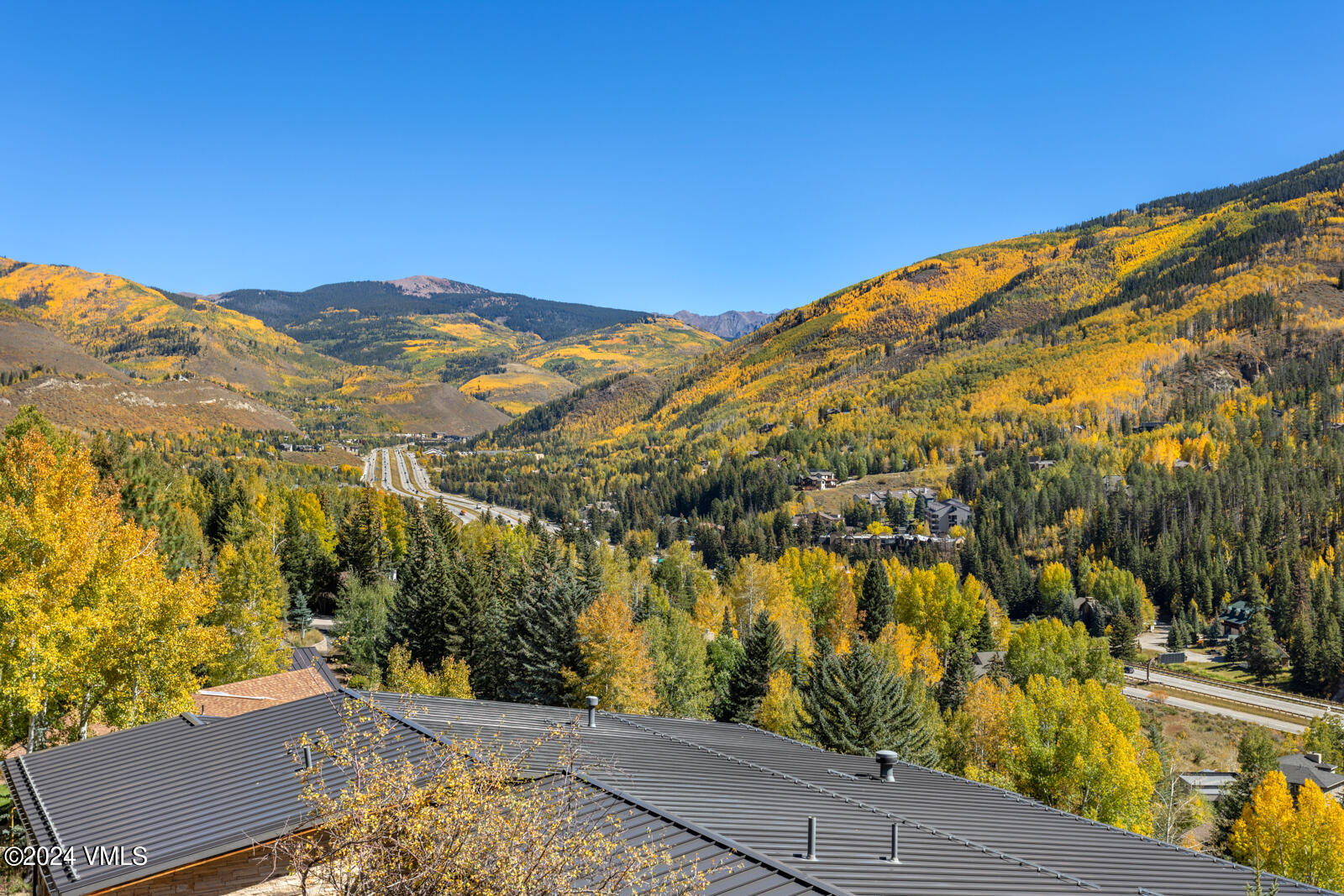 2701 Davos Trail Vail, CO 81657 - Photo 15 of 29 a view of a yard with a lake view