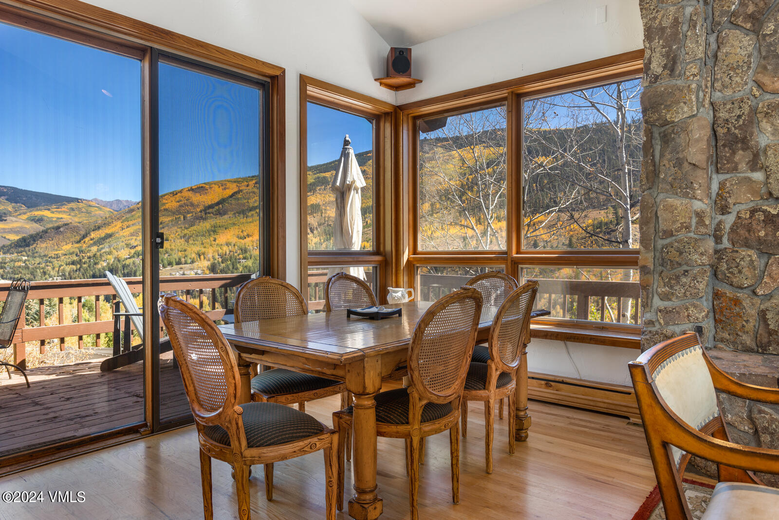 2701 Davos Trail Vail, CO 81657 - Photo 19 of 29 a view of a dining room with furniture large windows and wooden floor
