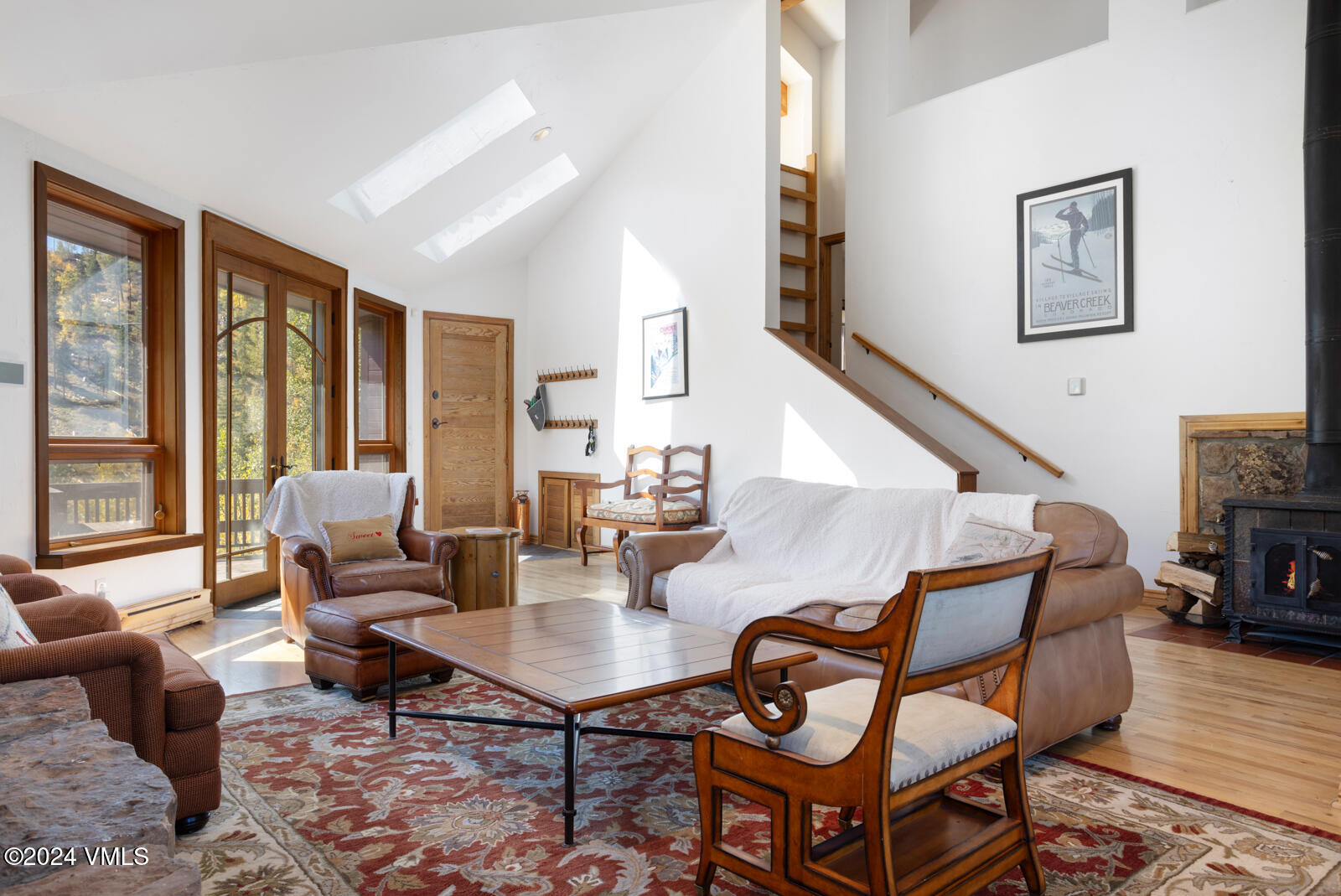2701 Davos Trail Vail, CO 81657 - Photo 20 of 29 a living room with fireplace furniture and a wooden floor