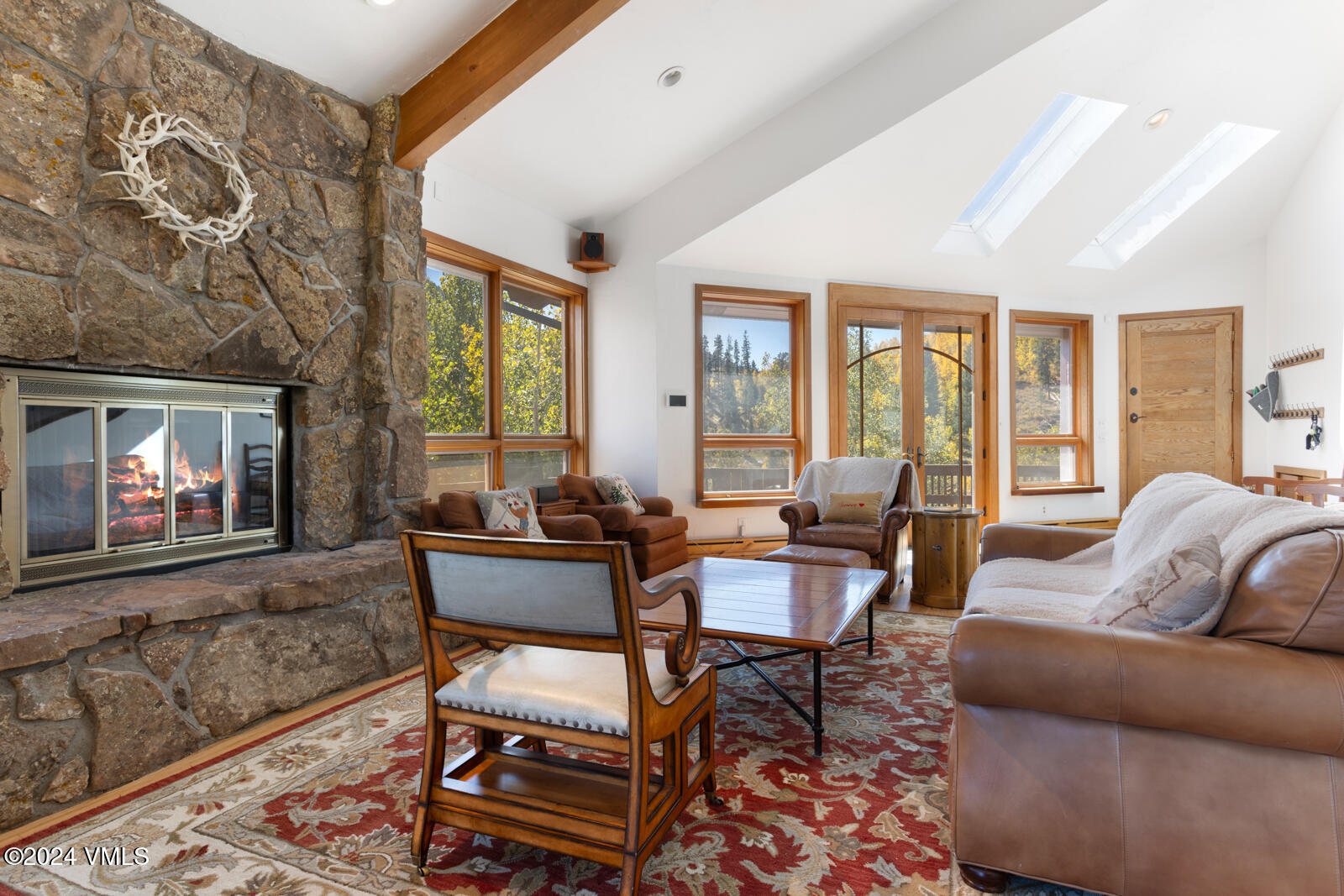 2701 Davos Trail Vail, CO 81657 - Photo 21 of 29 a living room with furniture and a large window