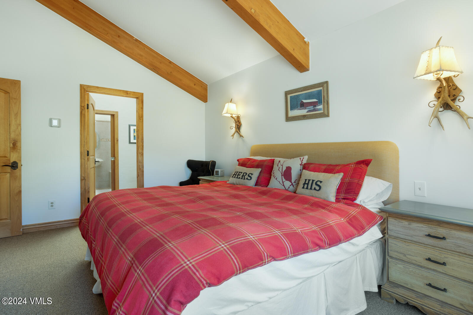 2701 Davos Trail Vail, CO 81657 - Photo 23 of 29 a bedroom with a bed and a lamp