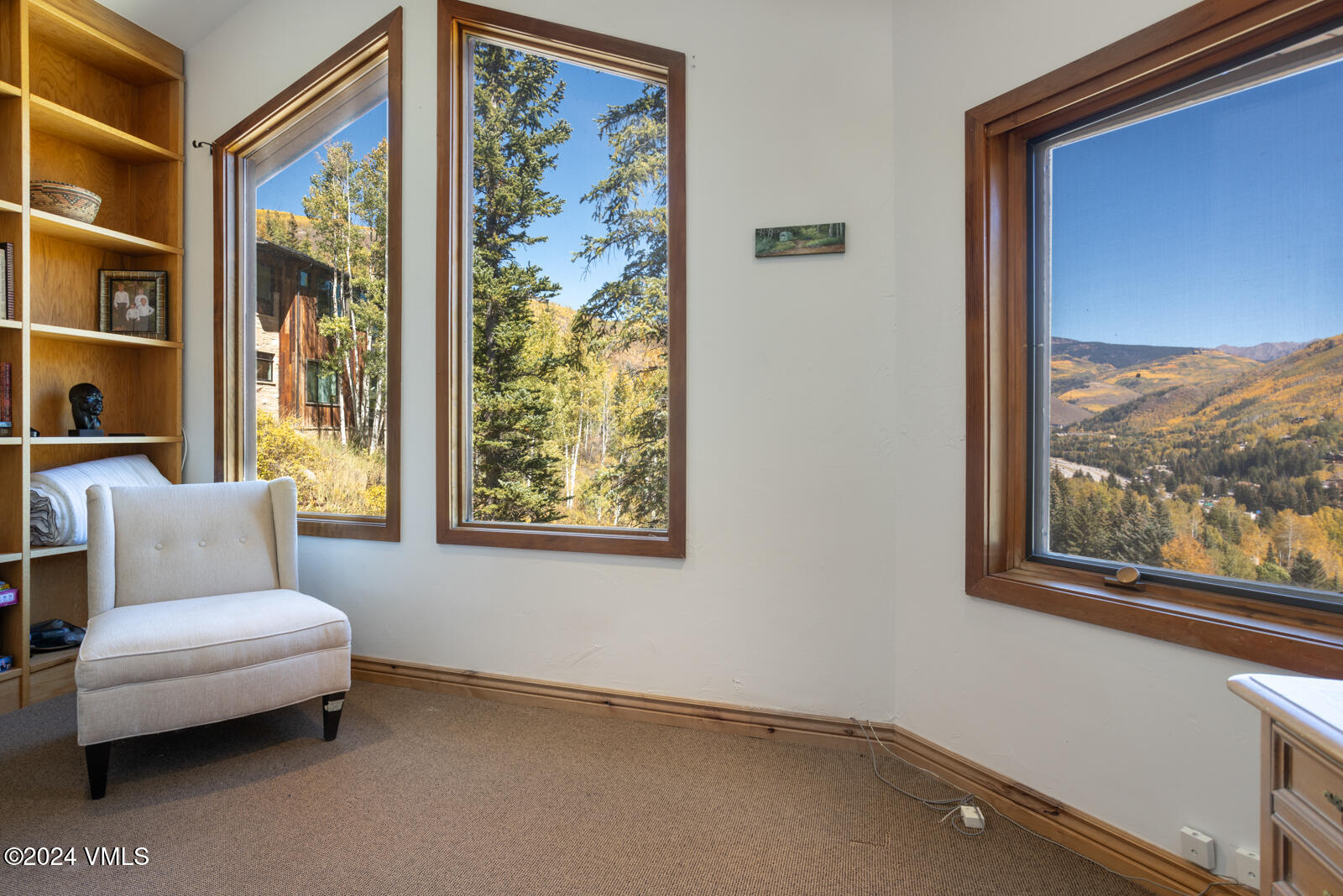 2701 Davos Trail Vail, CO 81657 - Photo 27 of 29 a living room with furniture and a window