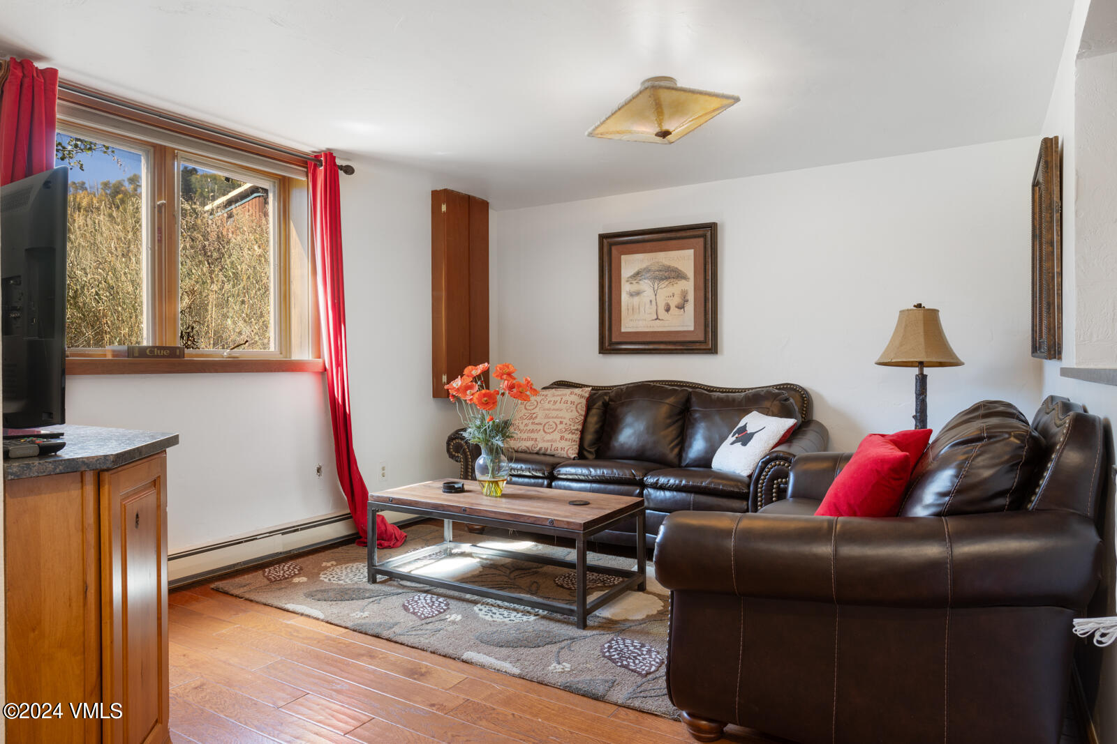 2701 Davos Trail Vail, CO 81657 - Photo 29 of 29 a living room with furniture and a flat screen tv
