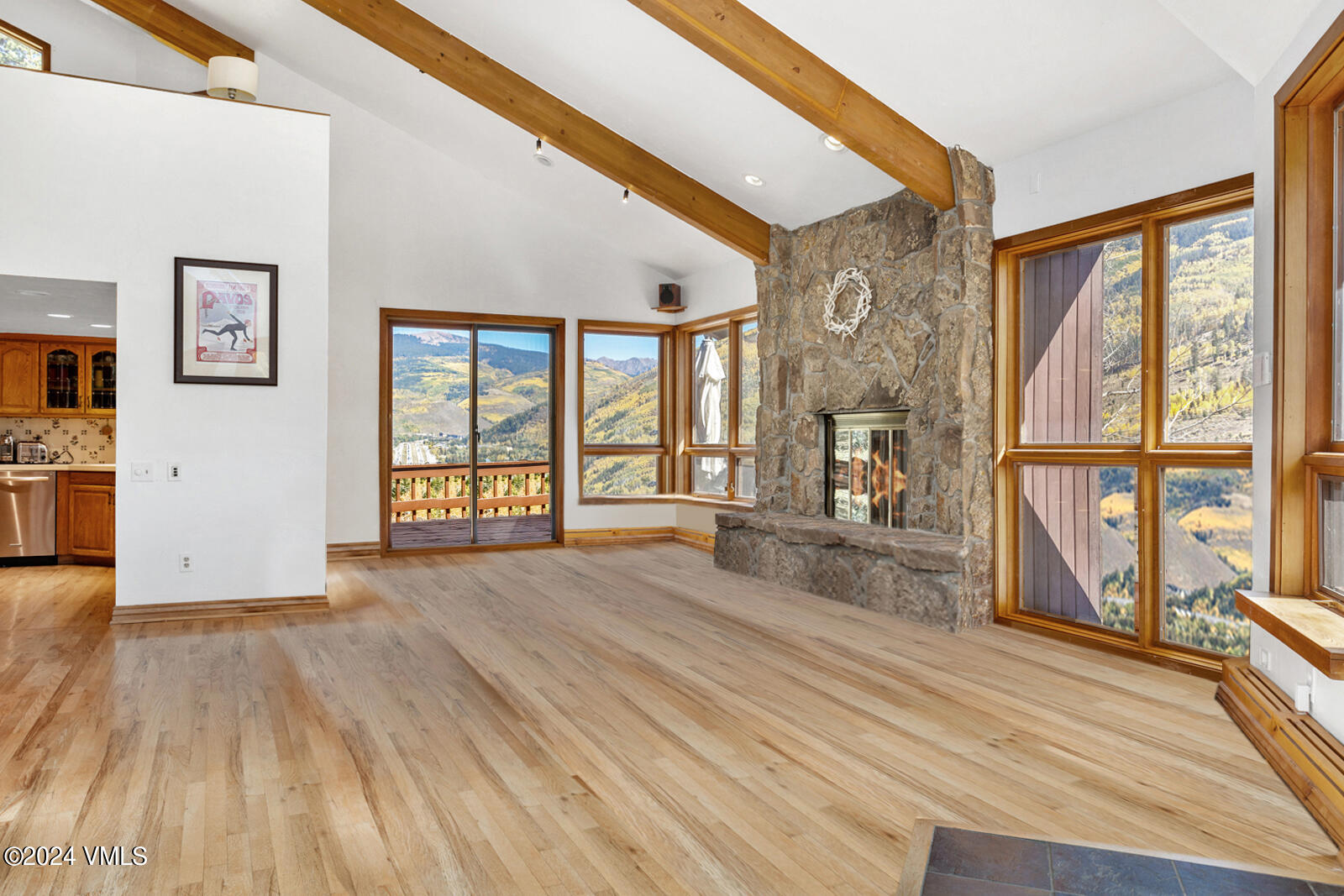 2701 Davos Trail Vail, CO 81657 - Photo 10 of 29 a view of an empty room with wooden floor and a window