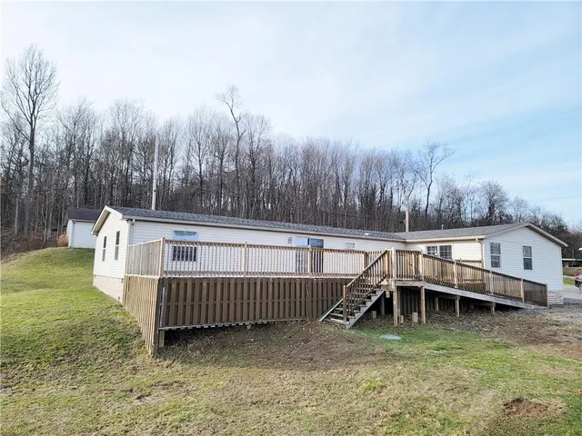 a view of a chair and table on the wooden floor