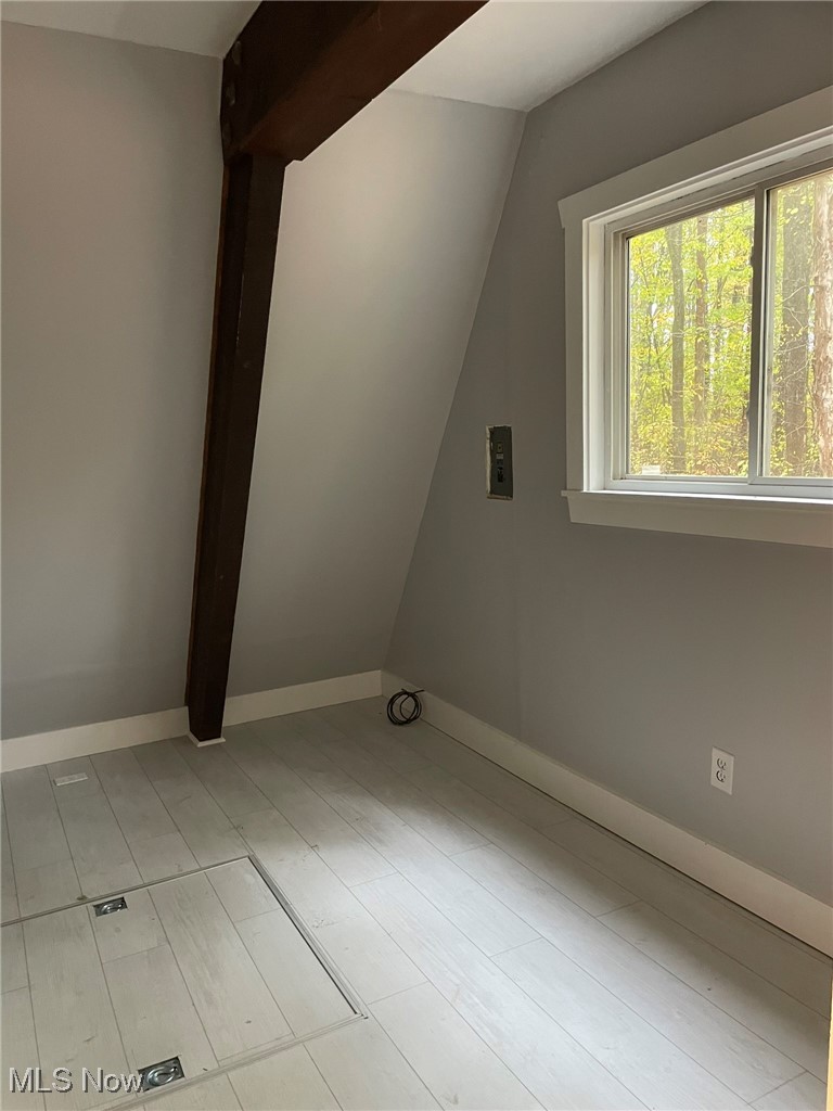 940 Long Shadow Lane Rome, OH 44085 - Photo 19 of 23 room with light wood-type flooring and baseboards