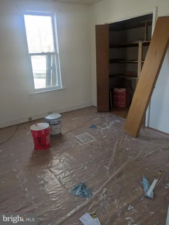 a view of an empty room with a gallery and wooden floor