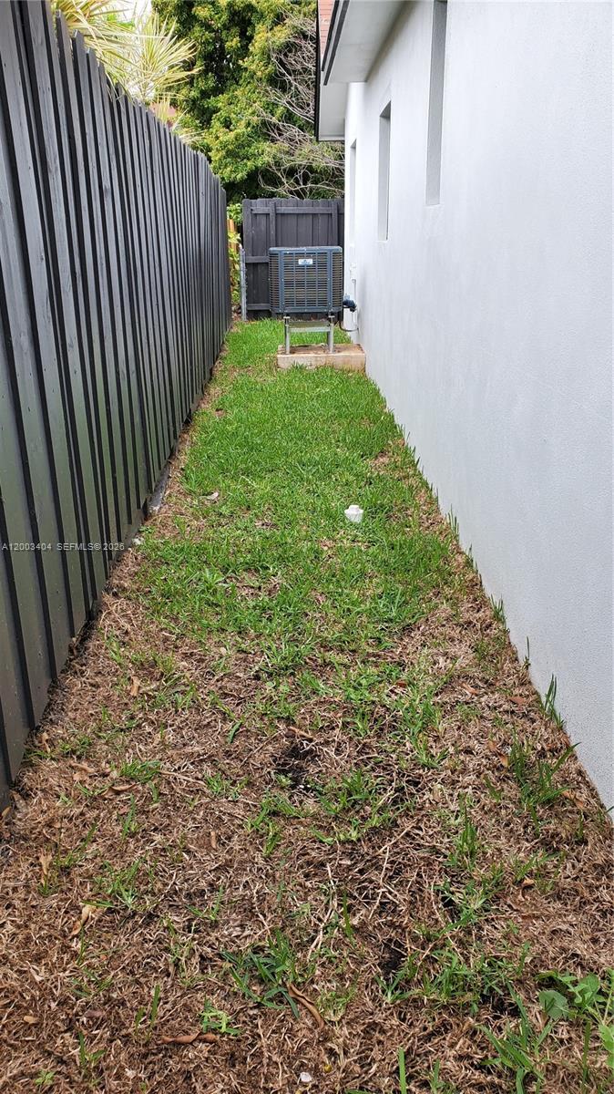 40 Southwest 34th Avenue, Unit C Miami, FL 33135 - Photo 18 of 24 a view of a backyard with pathway