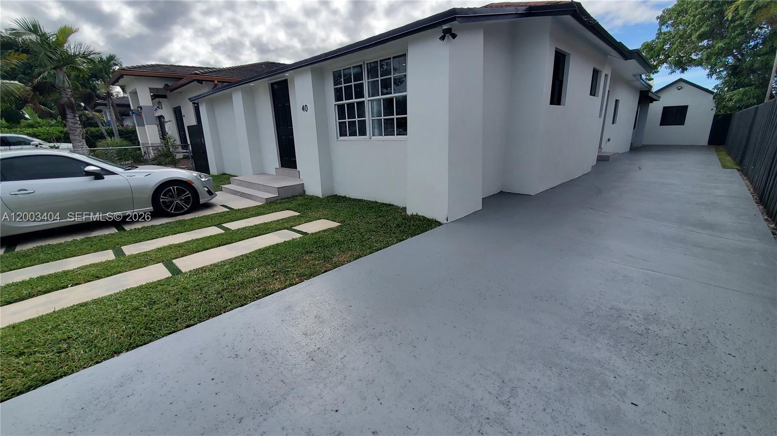 40 Southwest 34th Avenue, Unit C Miami, FL 33135 - Photo 22 of 24 a view of a house with a yard
