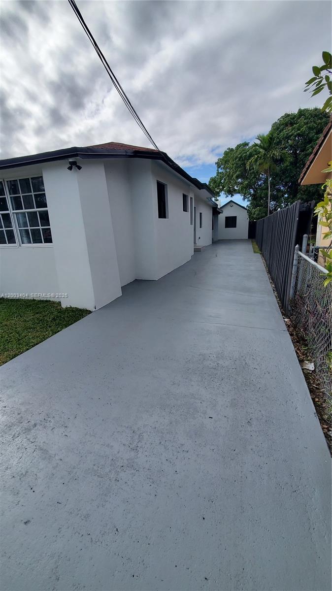 40 Southwest 34th Avenue, Unit C Miami, FL 33135 - Photo 23 of 24 a very nice looking house with a yard