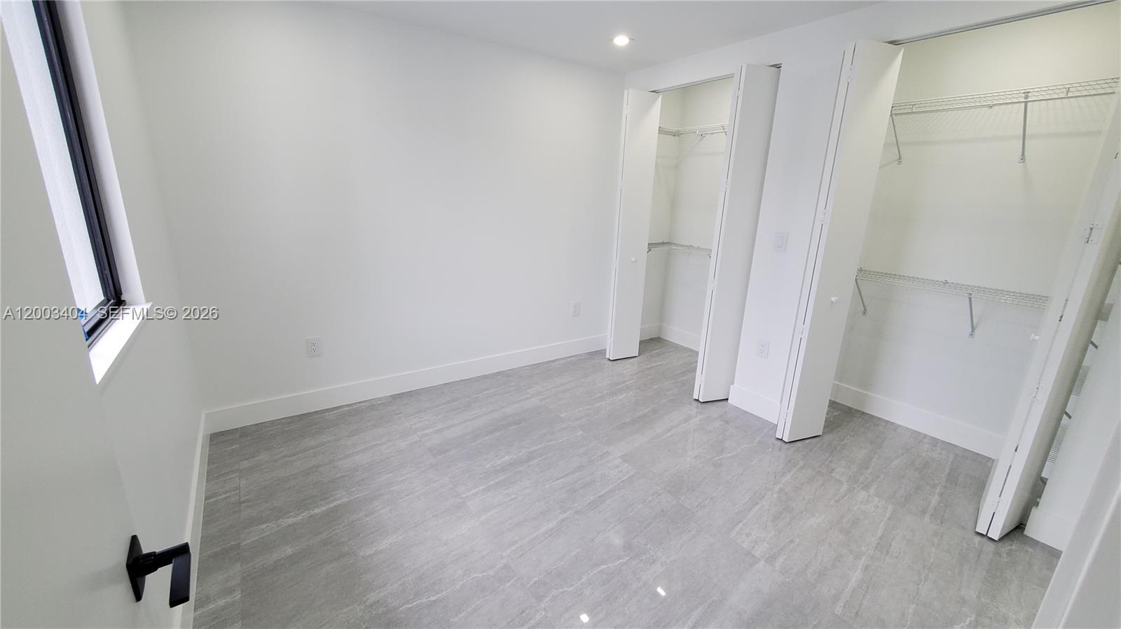 40 Southwest 34th Avenue, Unit C Miami, FL 33135 - Photo 8 of 24 a view of a room with wooden floor