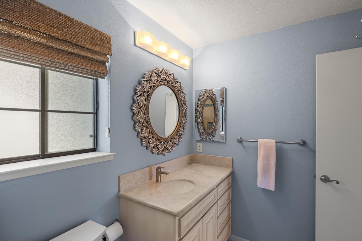 121 Quail Run Court Del Rey Oaks, CA 93940 - Photo 19 of 33 a bathroom with a sink and a mirror