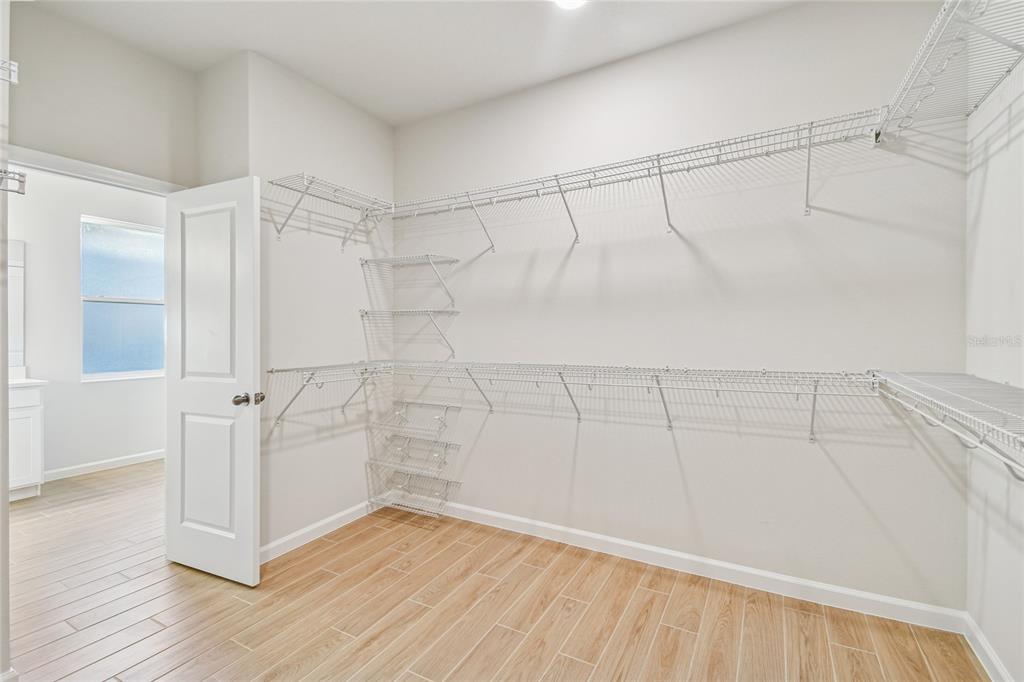 813 River Stone Trail Sanford, FL 32771 - Photo 12 of 33 a view of a room with wooden floor