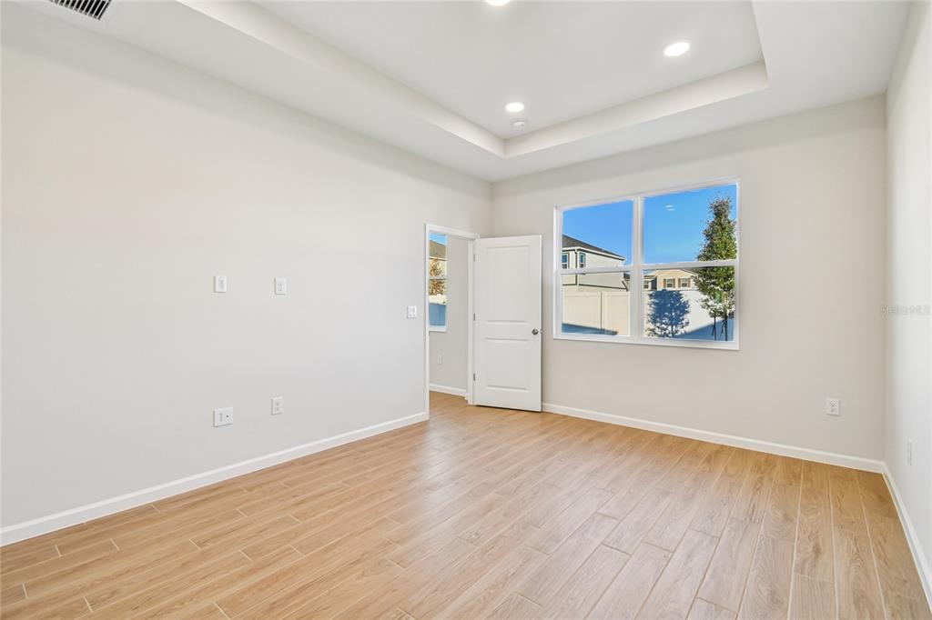 813 River Stone Trail Sanford, FL 32771 - Photo 19 of 33 a view of empty room with wooden floor