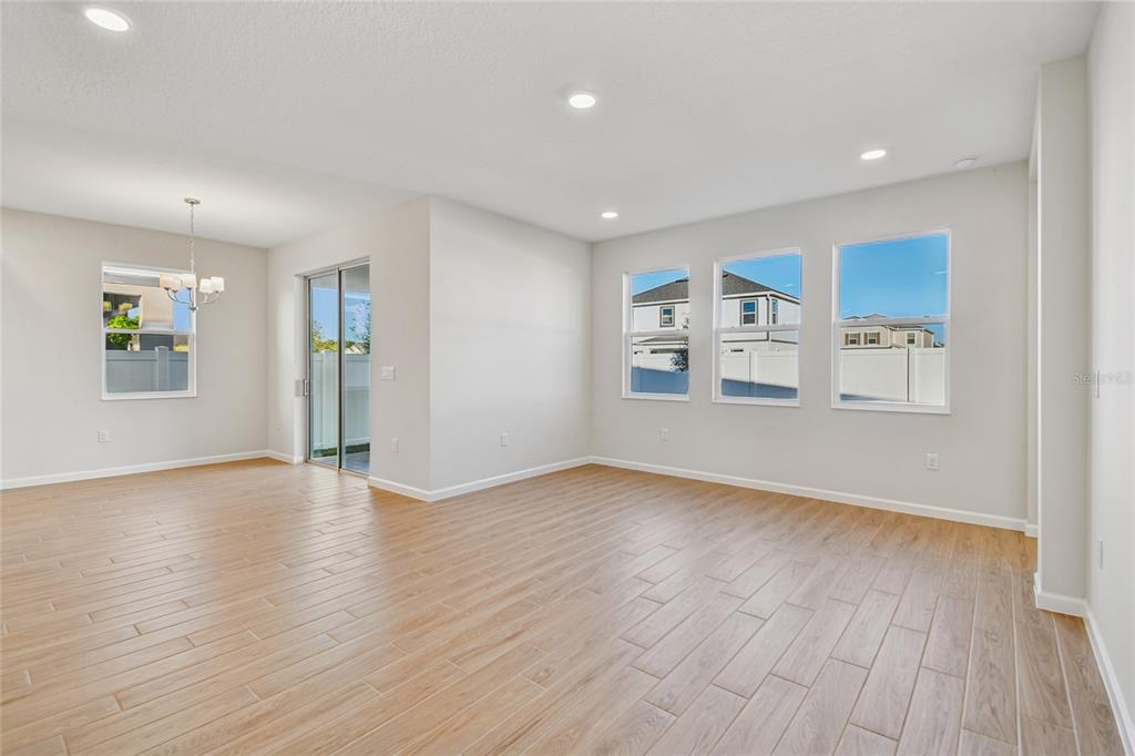 813 River Stone Trail Sanford, FL 32771 - Photo 22 of 33 wooden floor in an empty room with a window