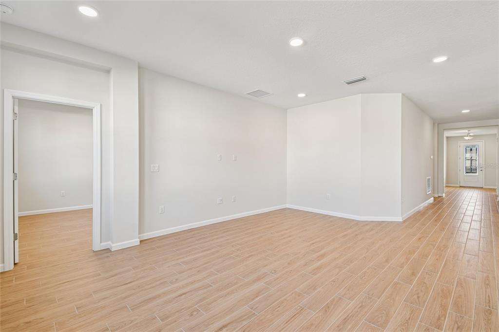 813 River Stone Trail Sanford, FL 32771 - Photo 23 of 33 a view of empty room with wooden floor
