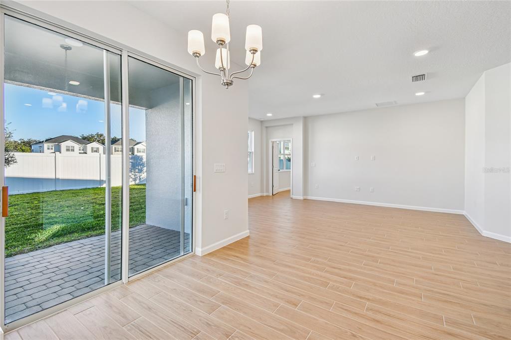 813 River Stone Trail Sanford, FL 32771 - Photo 25 of 33 a view of a room with wooden floor