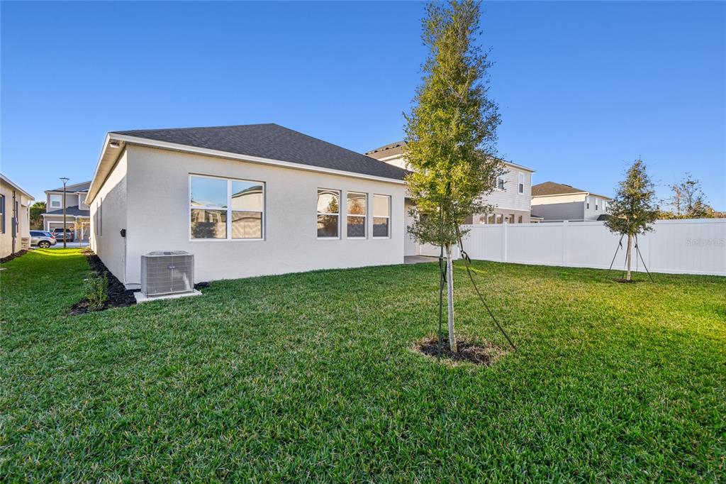 813 River Stone Trail Sanford, FL 32771 - Photo 26 of 33 a house view with a garden space