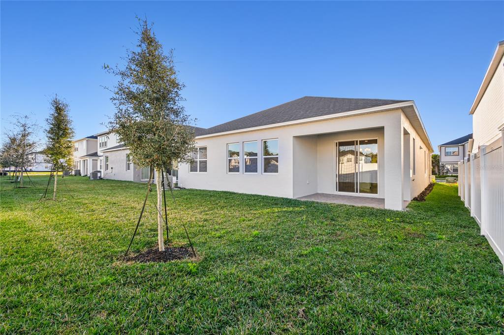 813 River Stone Trail Sanford, FL 32771 - Photo 28 of 33 a house view with a garden space