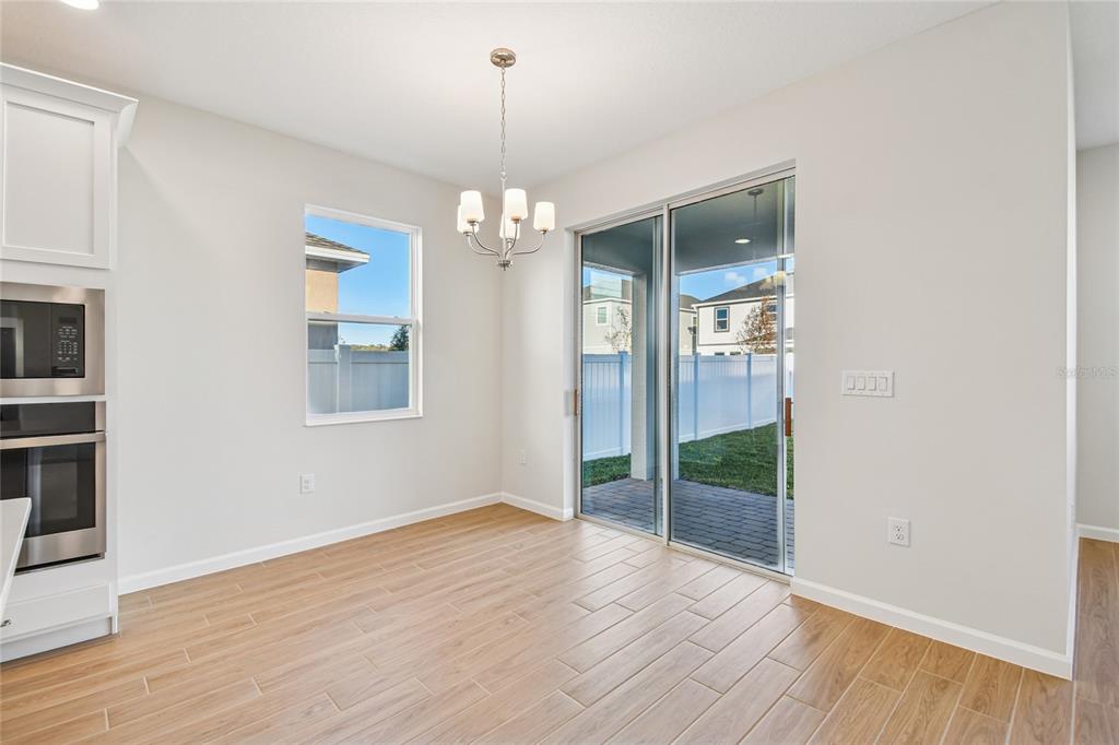 813 River Stone Trail Sanford, FL 32771 - Photo 9 of 33 a view of livingroom with hardwood floor and window