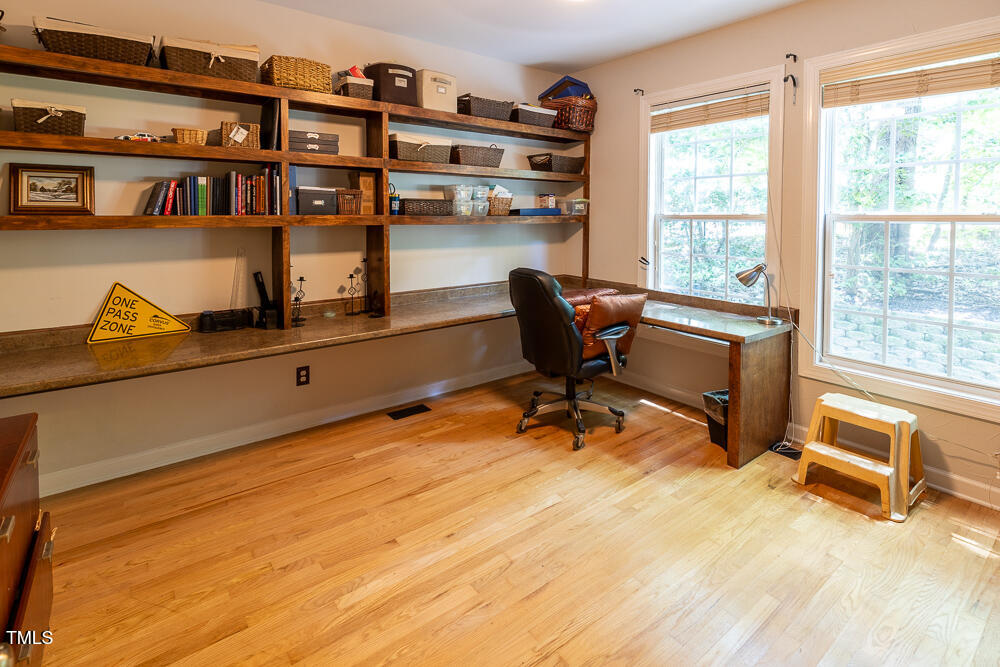 5240 Indigo Moon Way Raleigh, NC 27613 - Photo 22 of 74 a view of a workspace with furniture and a window