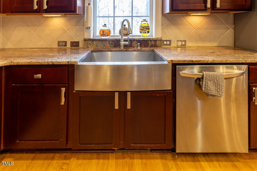 5240 Indigo Moon Way Raleigh, NC 27613 - Photo 3 of 74 a kitchen with stainless steel appliances granite countertop a sink and a refrigerator