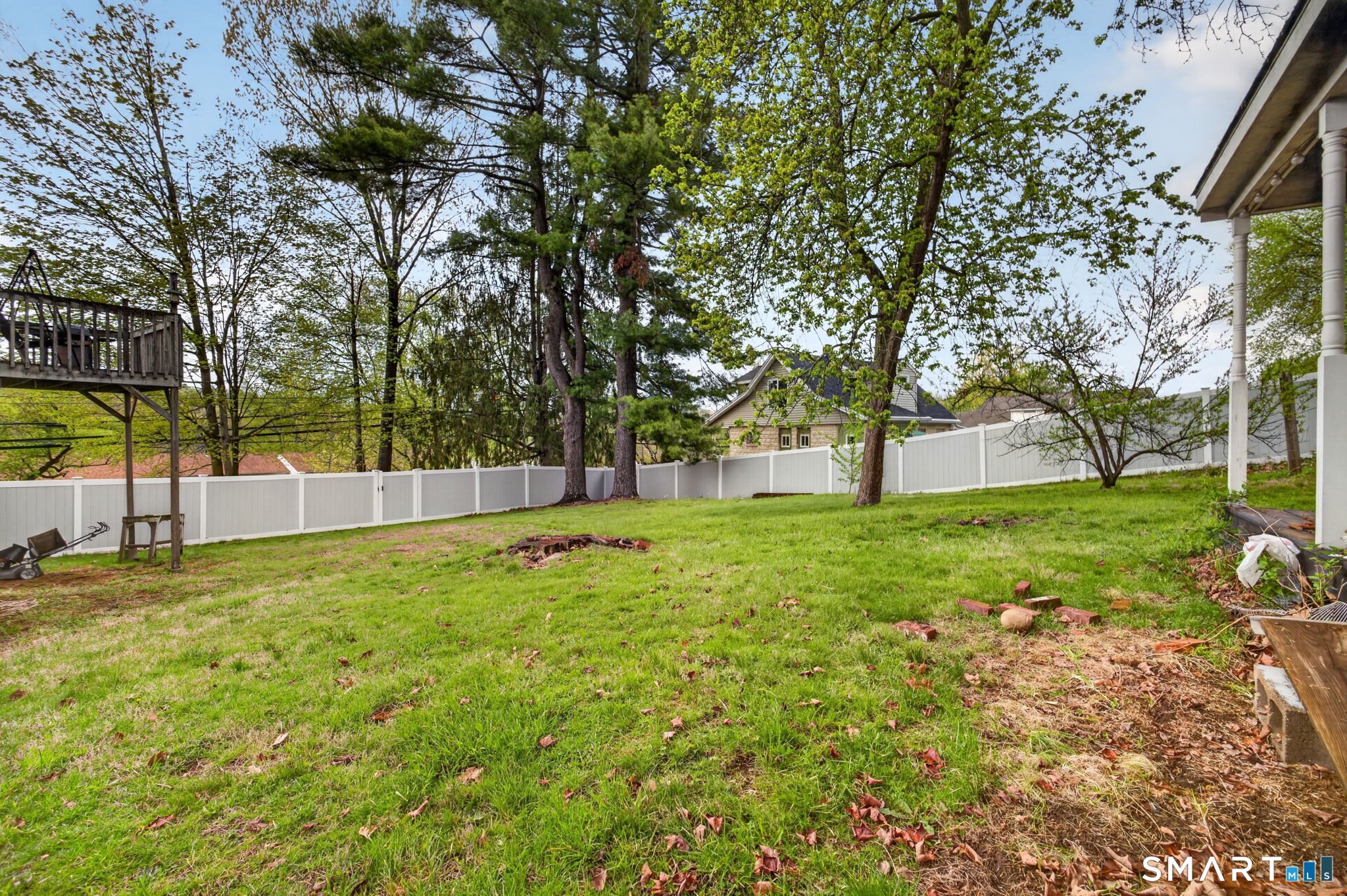 670 Hanover Road Meriden, CT 06451 - Photo 8 of 40 a view of yard with tree and wooden fence