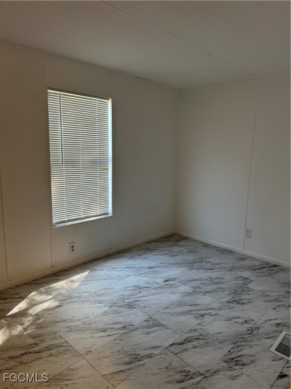 734 Midstate Loop Clewiston, FL 33440 - Photo 21 of 25 a view of an empty room with wooden floor and a window