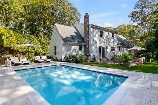 a bathroom with a sink a toilet and shower curtain