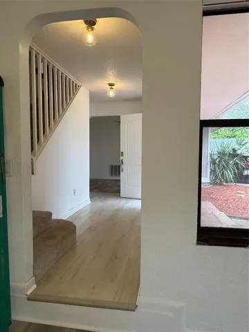 a bathroom with a window and a light fixture