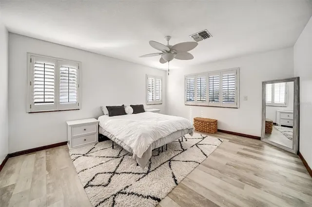 a view of a lake with houses in the background