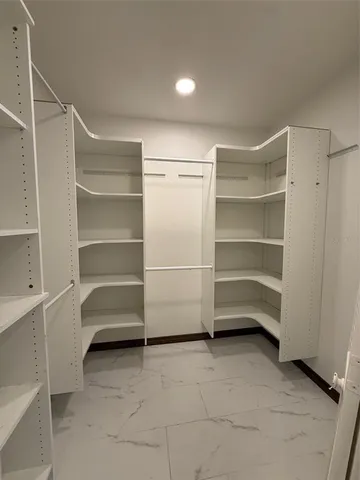 a view of walk in closet with window