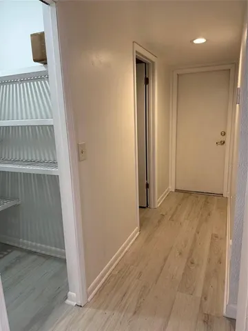 a bathroom with a shower and a mirror