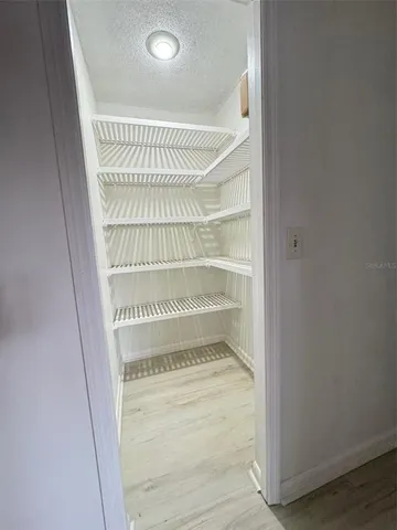 a bathroom with a granite countertop sink a toilet and bathtub