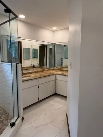 a view of a backyard with sitting area