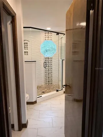 a view of a swimming pool with a lounge chair