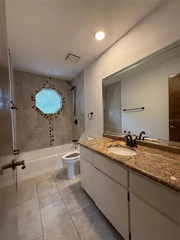 a view of a house with backyard and porch