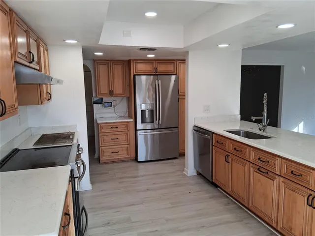 a kitchen with a stove and a microwave