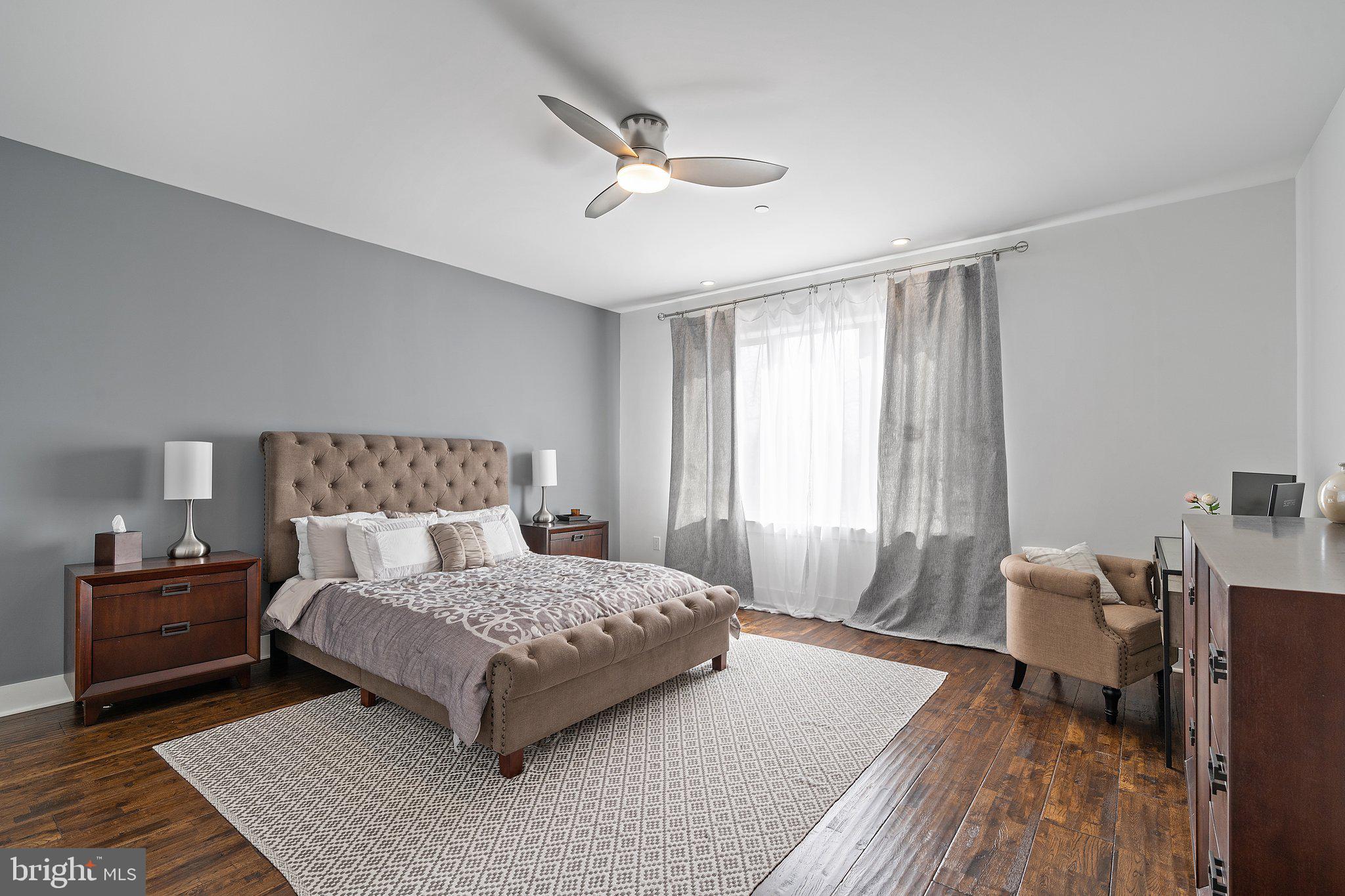 329 Delmar Street Philadelphia, PA 19128 - Photo 5 of 20 a bedroom with a bed and a couch