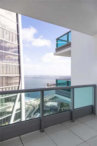 a view of a balcony and floor to ceiling windows