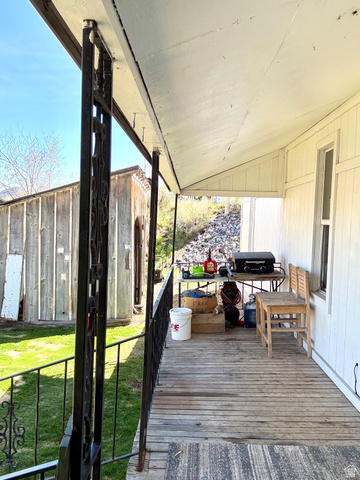 175 Eagle Street Eureka, UT 84628 - Photo 23 of 31 Deck with a lawn and a grill