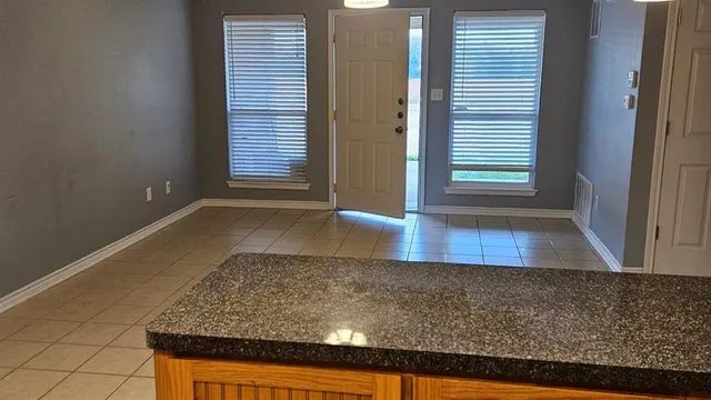 an empty room with wooden floor